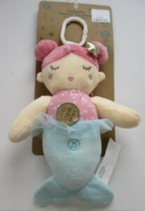 A blue and pink plush mermaid toy with a hook for stroller